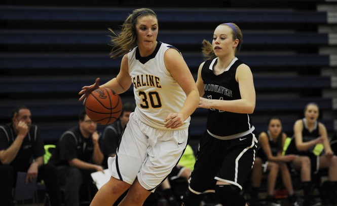 Saline High School senior Caitlin Ellis dribbles in the game against Woodhaven on Tuesday, March 5. Daniel Brenner I AnnArbor.com